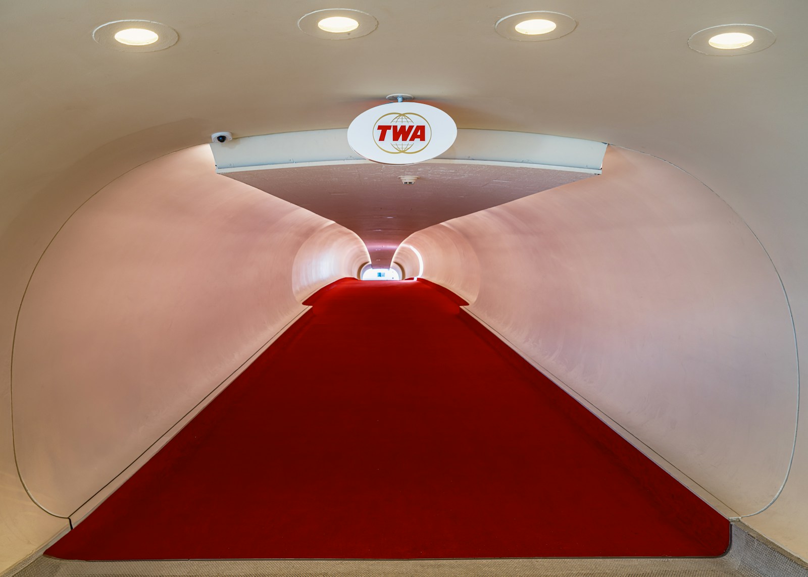 Red carpet tunnel and TWA sign inside the restored JFK flight center