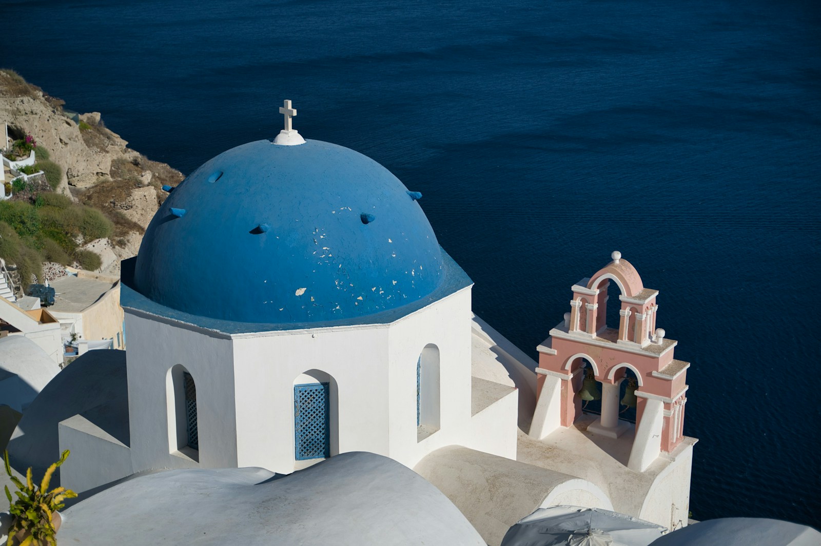 Blue-domed church in Oia overlooking the Santorini caldera