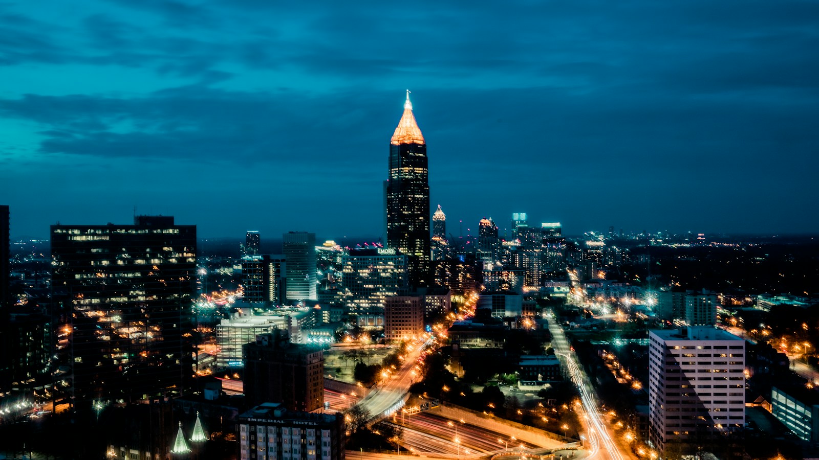 Atlanta skyline illuminated beneath a blue-hour sky