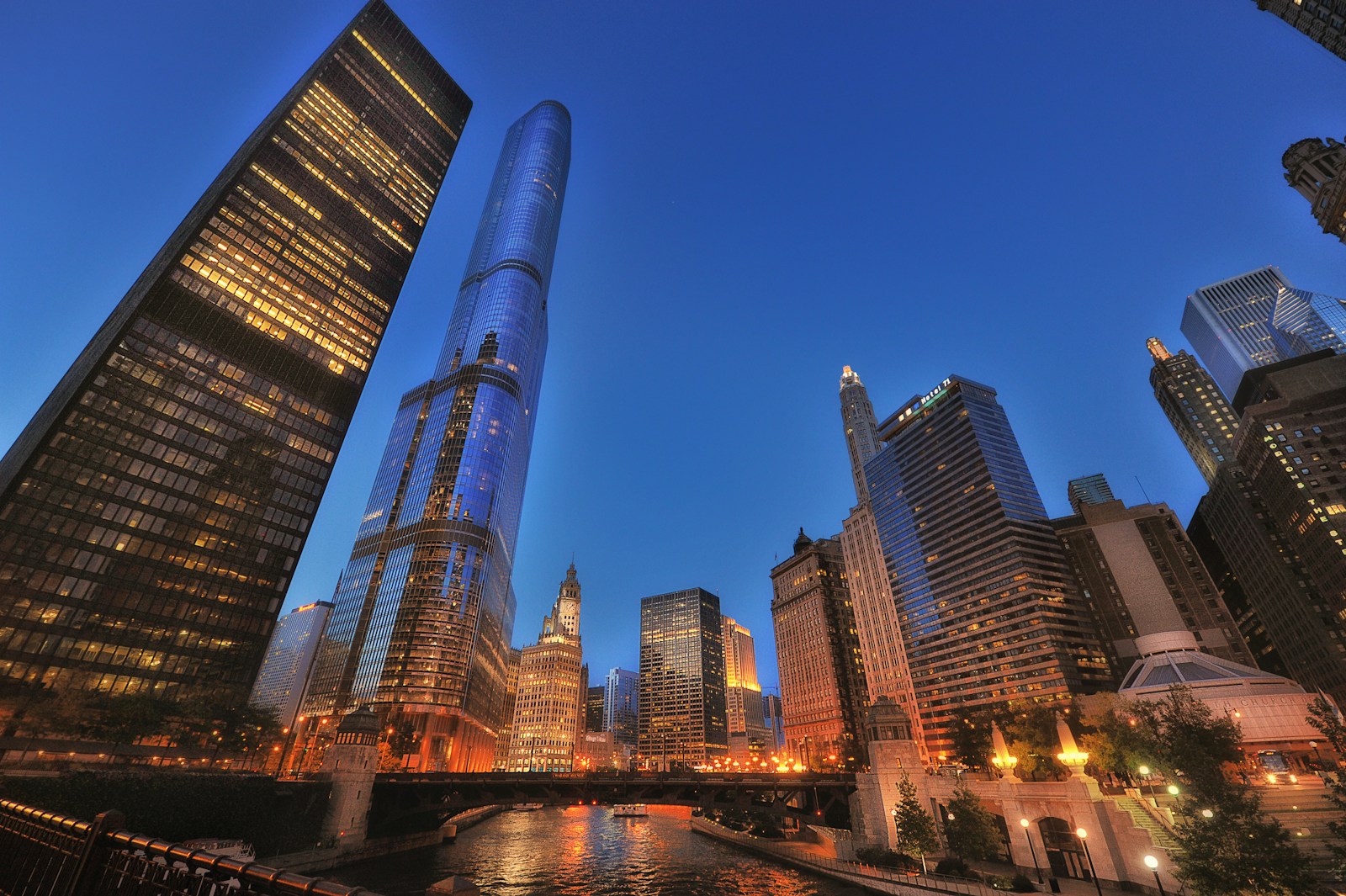 Chicago River bridge and illuminated skyscrapers at blue hour