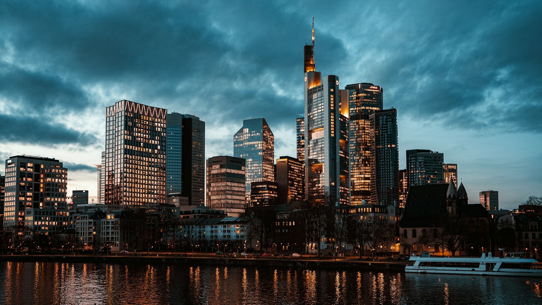 Frankfurt financial skyline at dusk across the Main