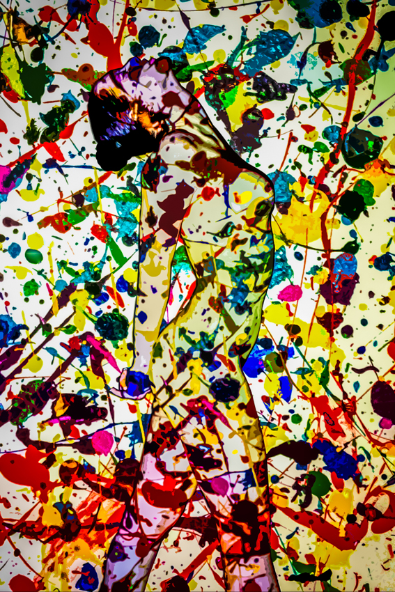A nude figure partly hidden within a dense multicolored abstract collage.