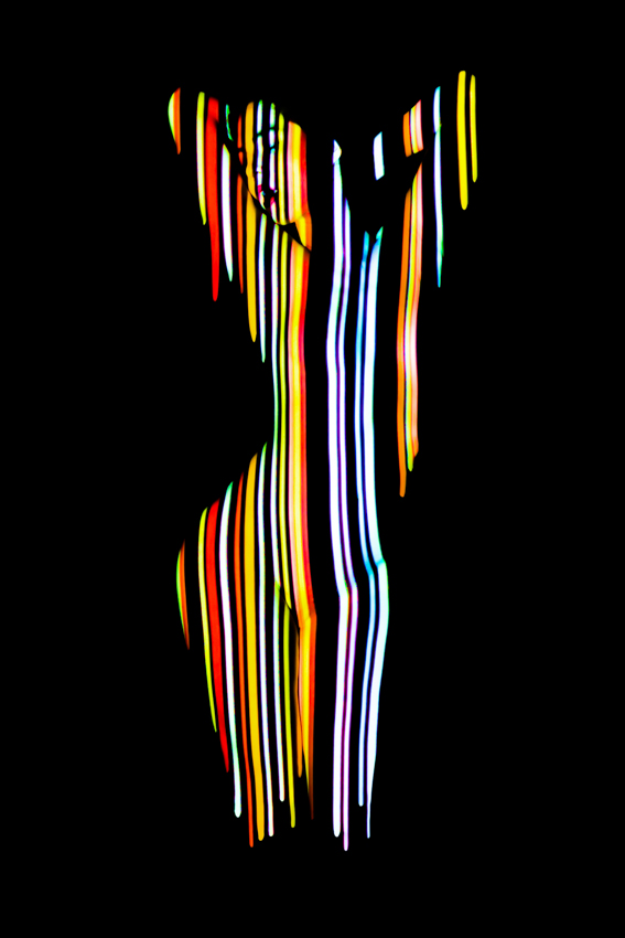 Silhouette of a figure formed by narrow colored light stripes on a black background.