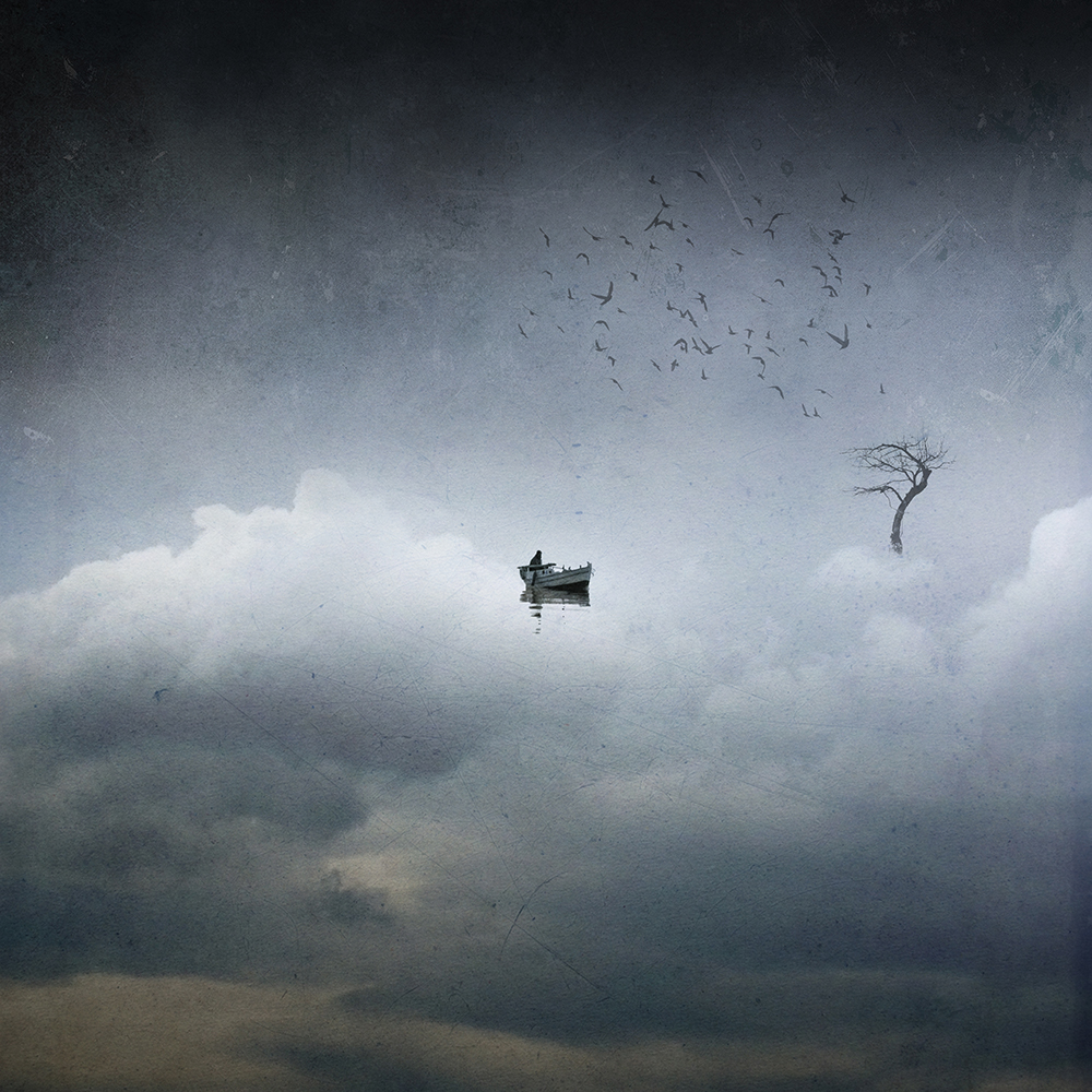 A small boat floats among clouds as birds circle overhead and a bare tree rises on the right.