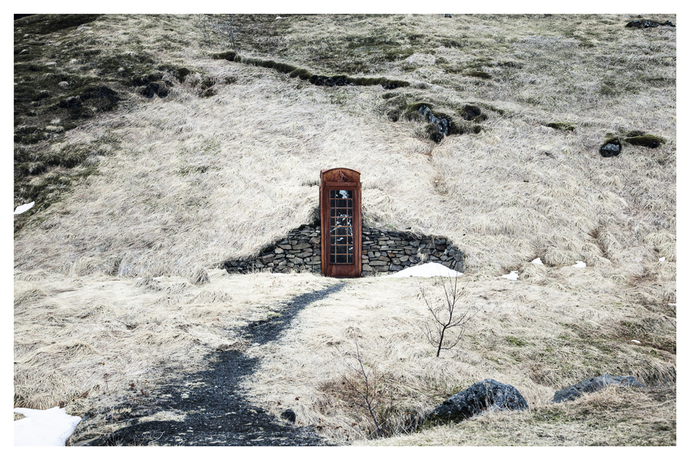 A narrow path leads to a wooden door built into a grassy hillside - Pause by Juan Antonio Partal