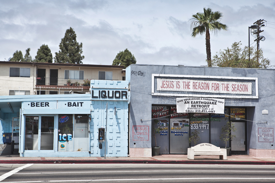 Low roadside liquor store with signs for beer and bait.