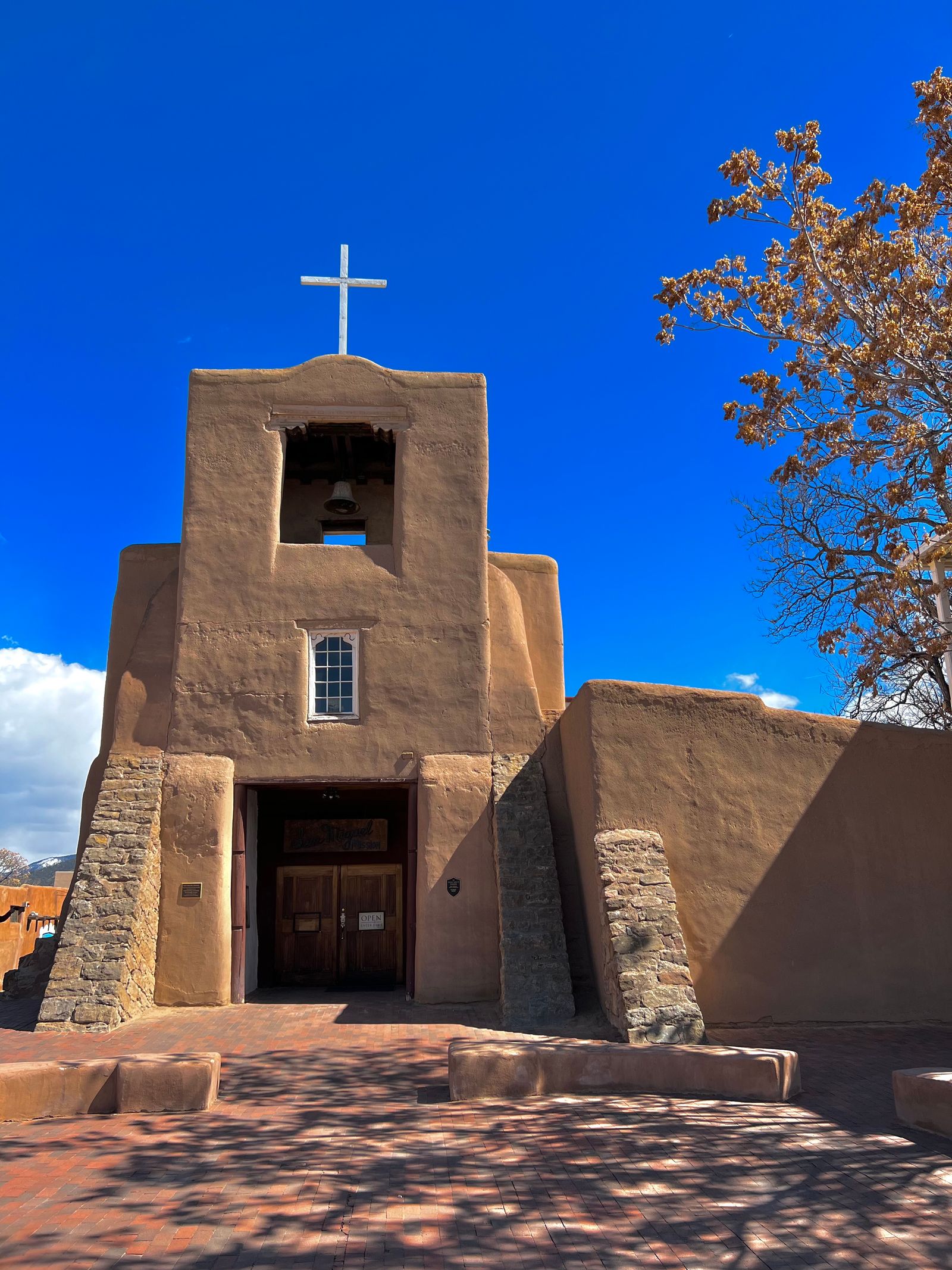 San Miguel Mission chapel in Santa Fe, New Mexico, the oldest church in the USA, adobe architecture under a deep blue sky