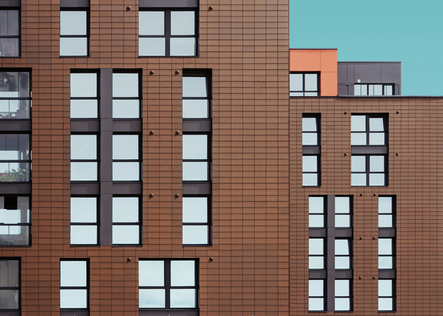 Patterned apartment building against sky