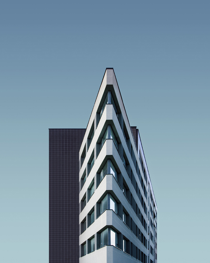 Pointed roofline against a pale blue sky