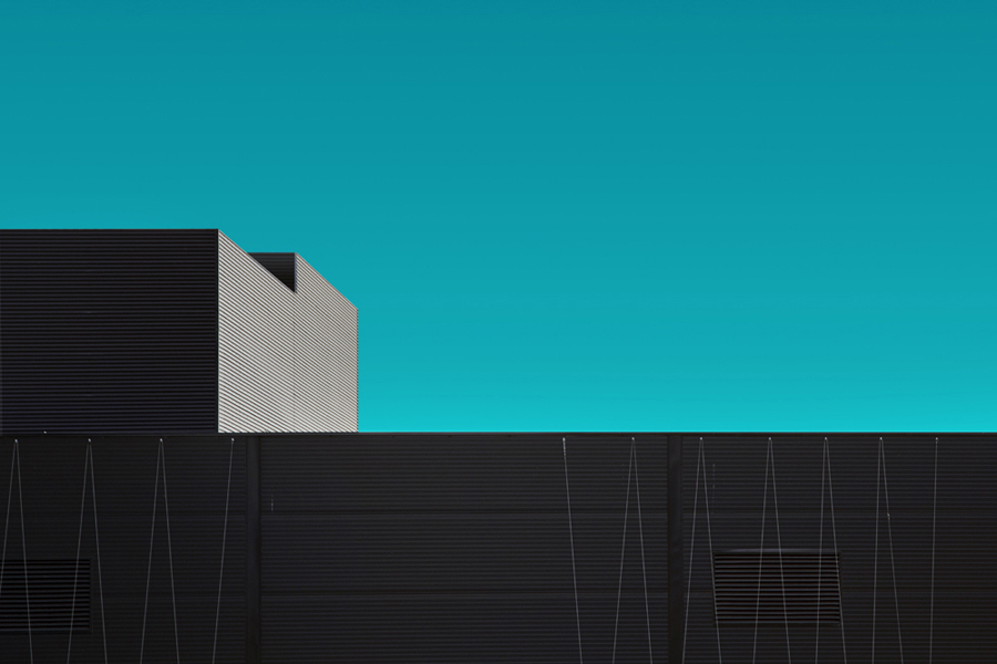 Abstract building edge against a blue-green sky
