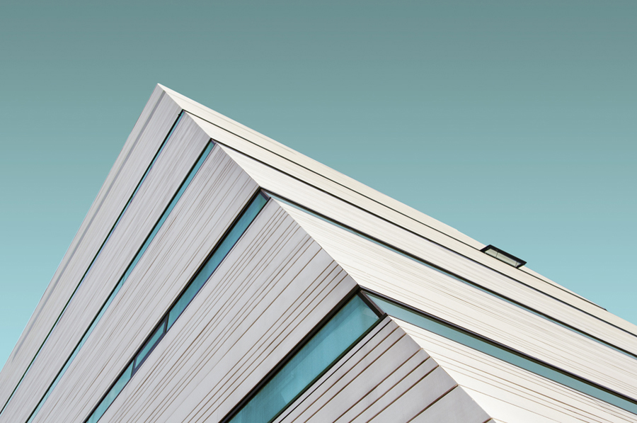 White angular roof against teal sky