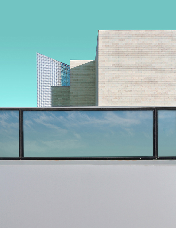 Modern low building against a cyan sky