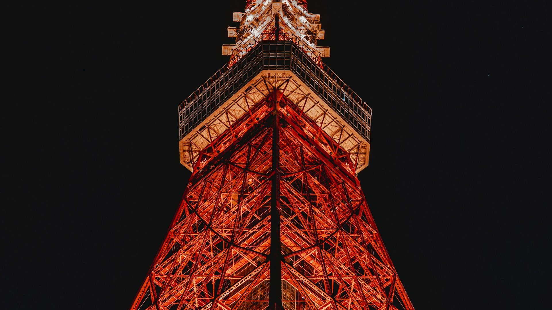 Tokyo Tower glowing orange against the night sky