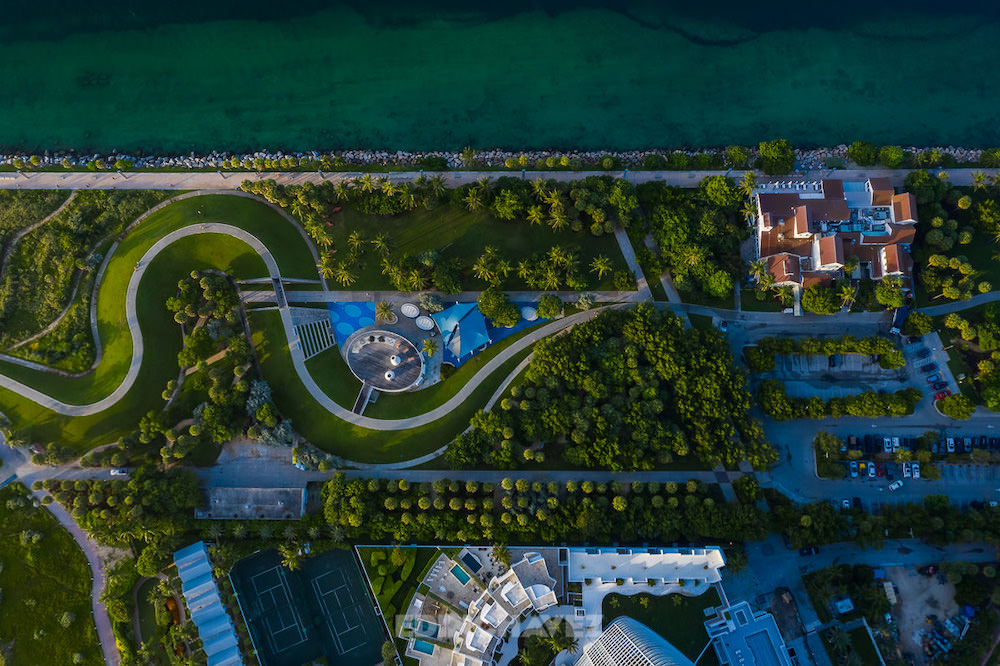 Edin Chavez aerial view looking straight down on South Pointe Park's paths, trees and shoreline in Miami