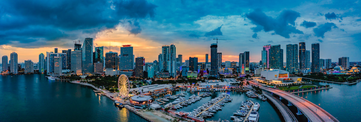 Edin Chavez aerial panorama of Miami's skyline, marina and waterfront at sunset