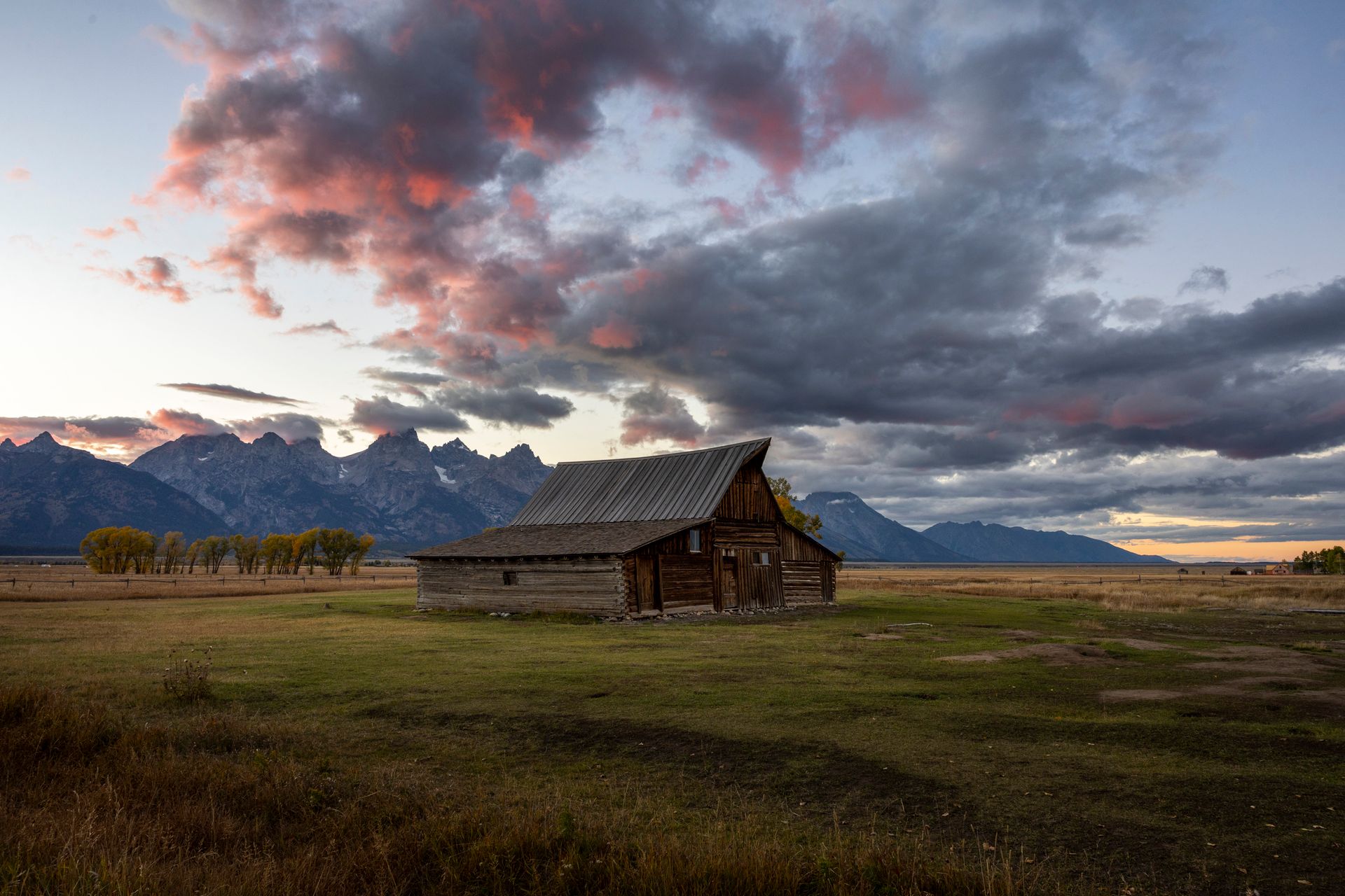 T.A. Moulton Barn on Mormon Row at sunset with the Teton range behind