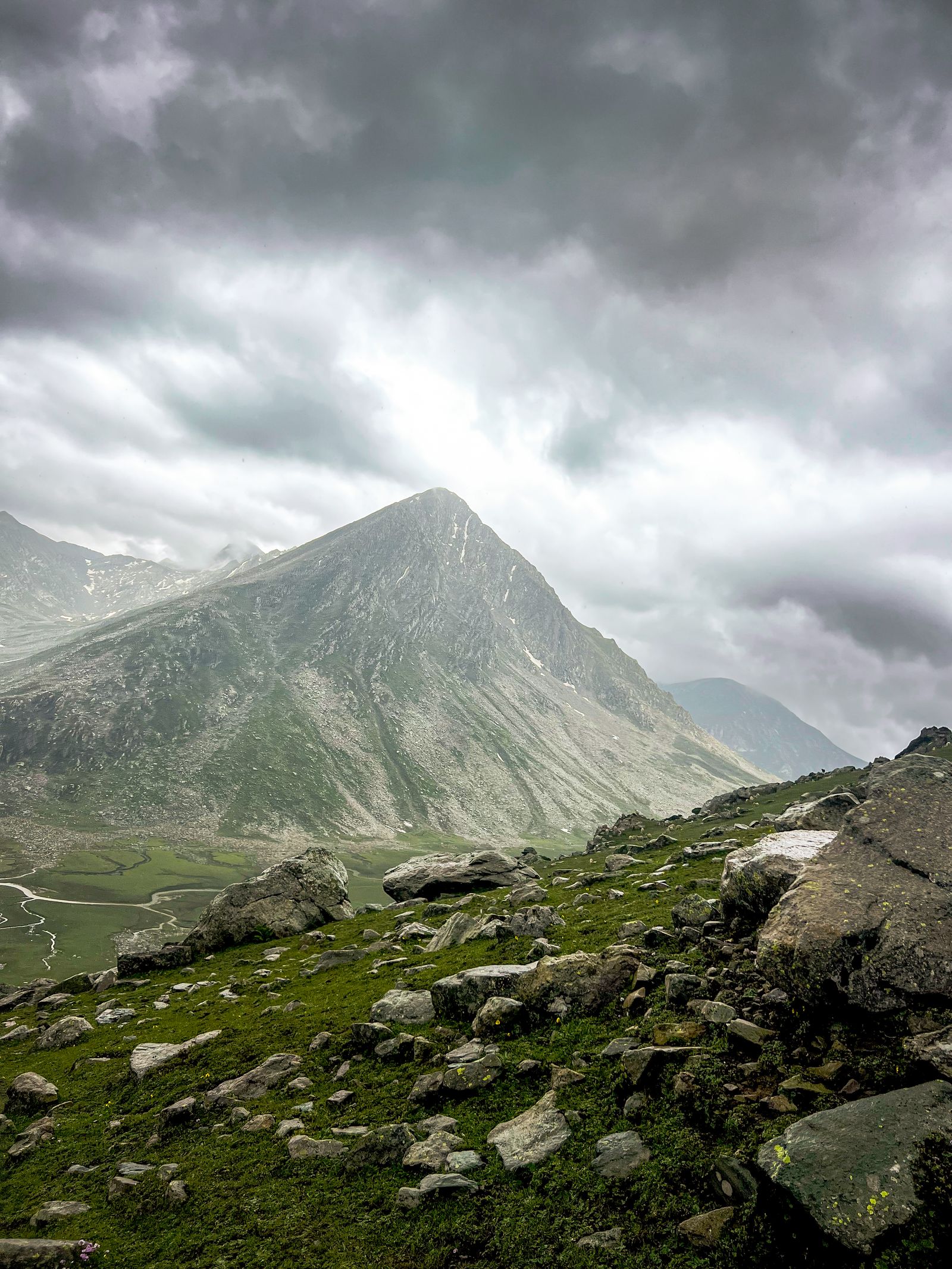 Mountain landscape under moody clouds