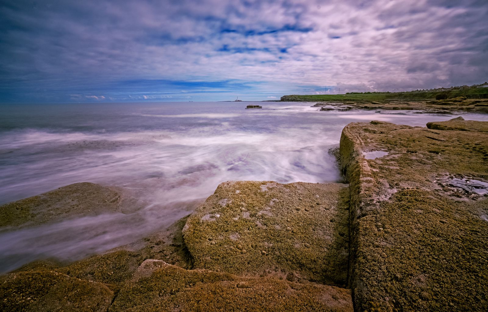Long exposure of waves breaking on a rocky shore
