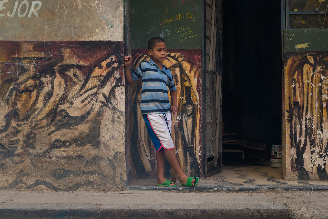 Narrow Havana street lined with colorful colonial buildings, Cuba, photographed by Edin Chavez