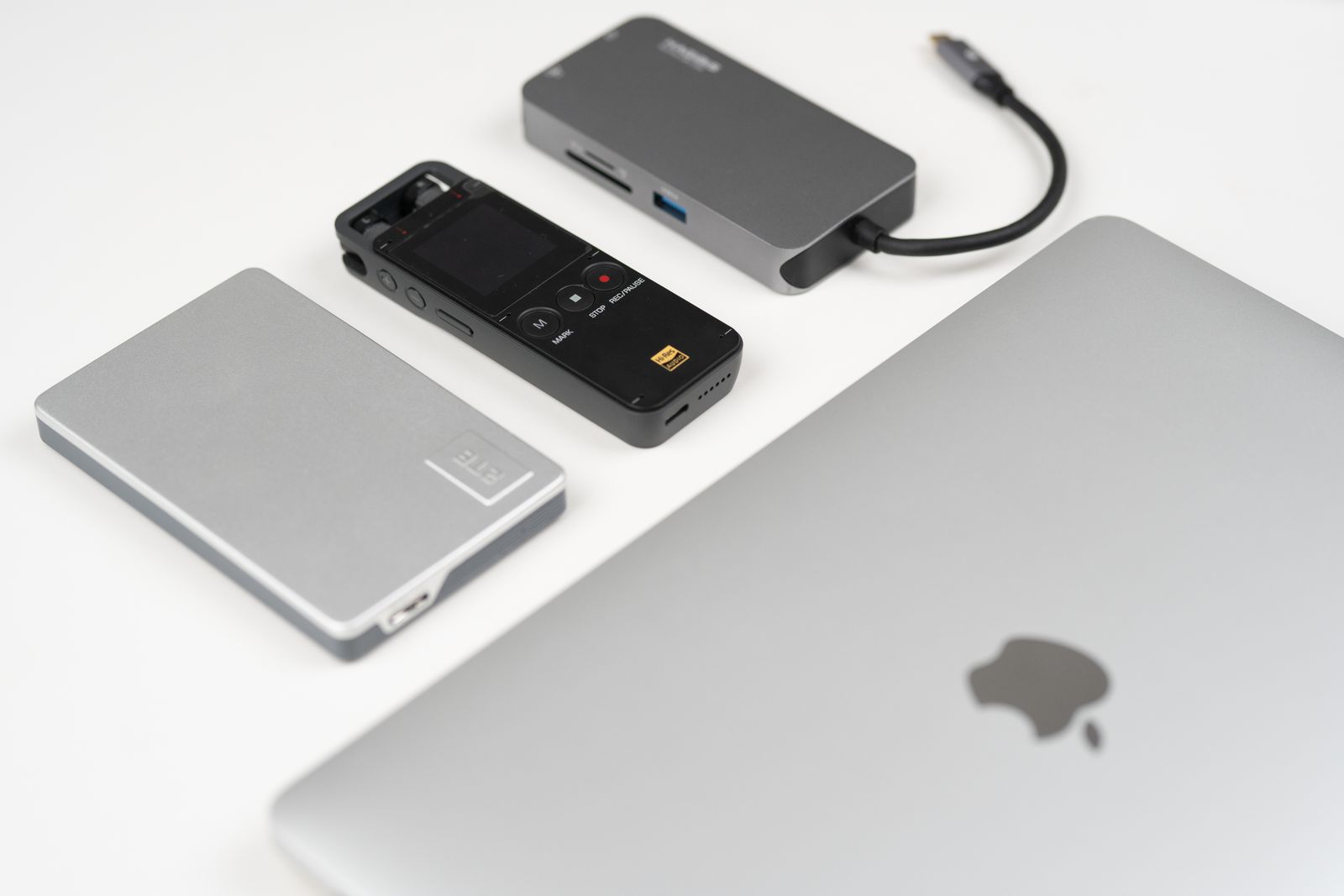 Laptop and external drives on a desk