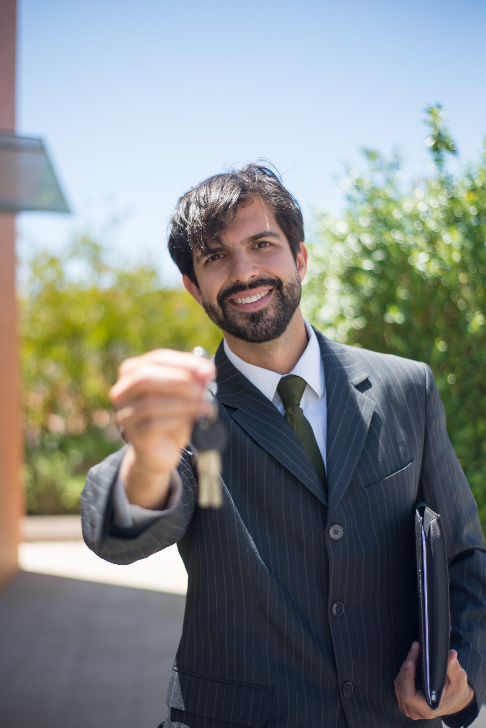 Real estate agent holding house keys