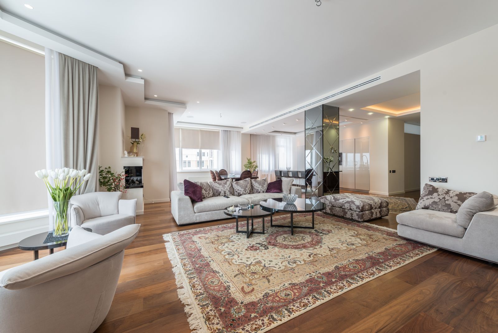 Bright wide-angle living room interior with even light and straight walls, the look a finished real estate edit aims for