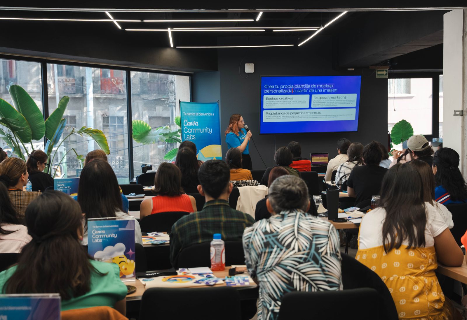 Attendees at a corporate workshop listening to a presenter