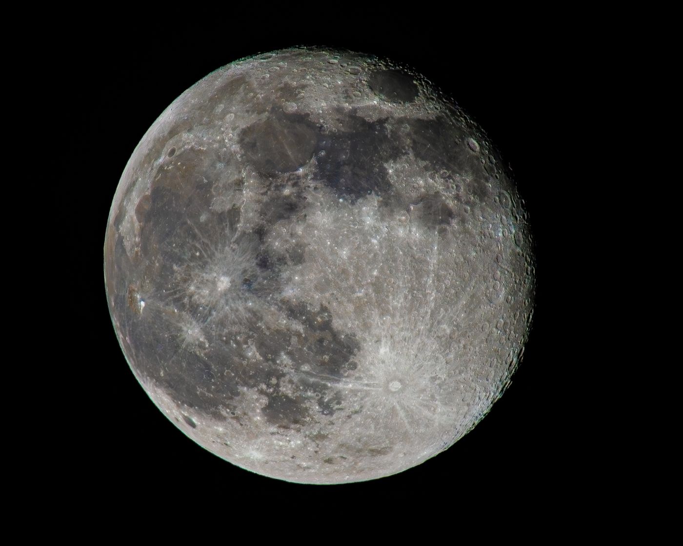 Full moon with visible craters against a black sky