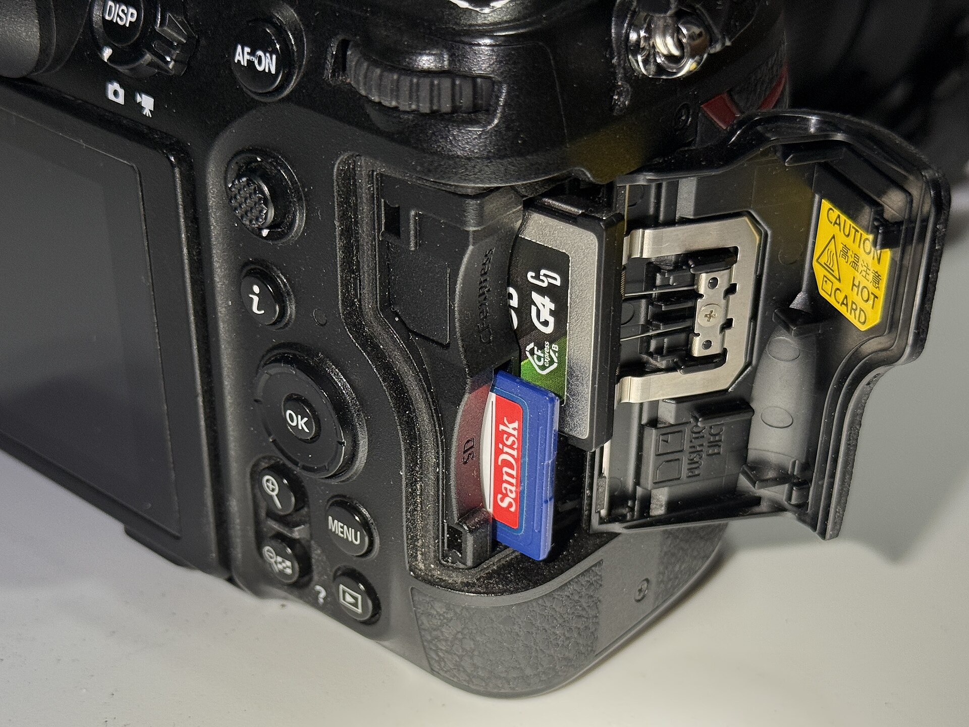 Nikon Z8 card door open showing the CFexpress Type B and SD card slots used for backup recording at weddings