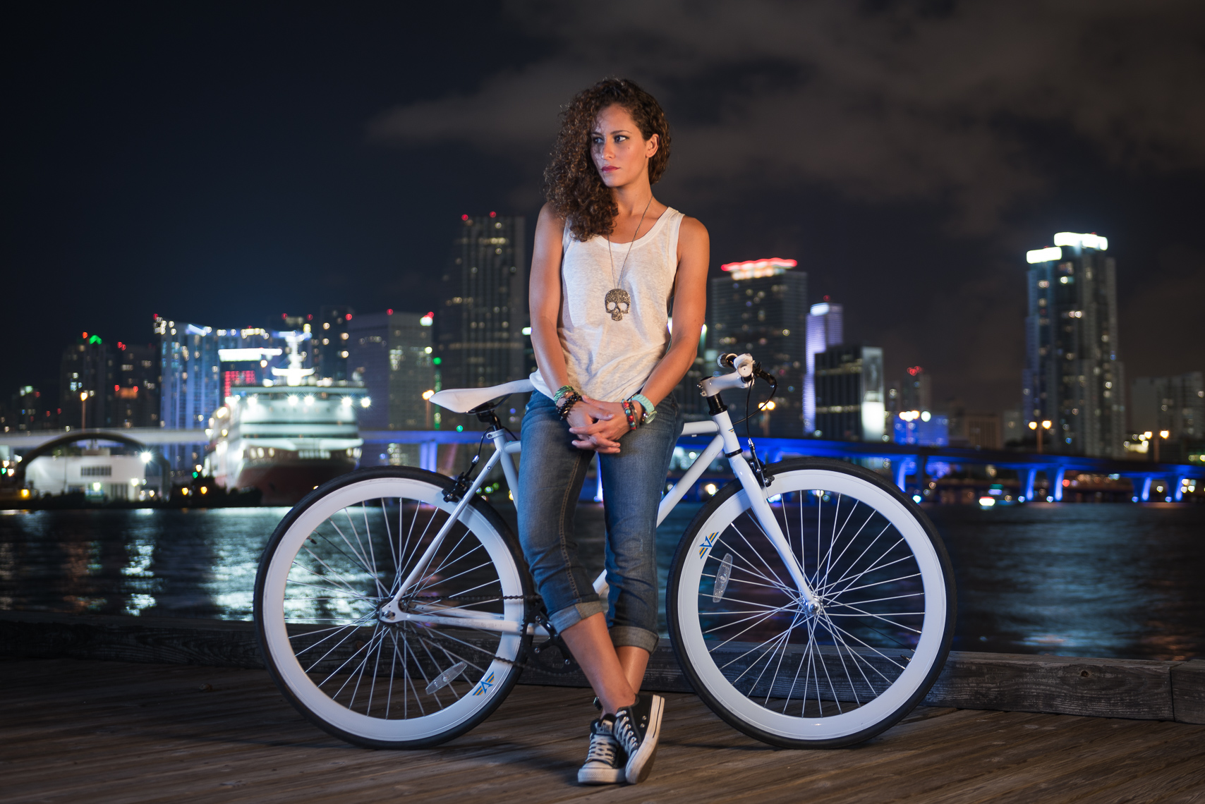 The after frame of the same night portrait, with cooler tones and a moodier sky over the Miami skyline