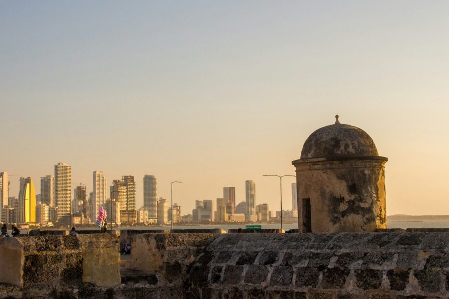 Warm light on Cartagena stone walls with buildings in the distance