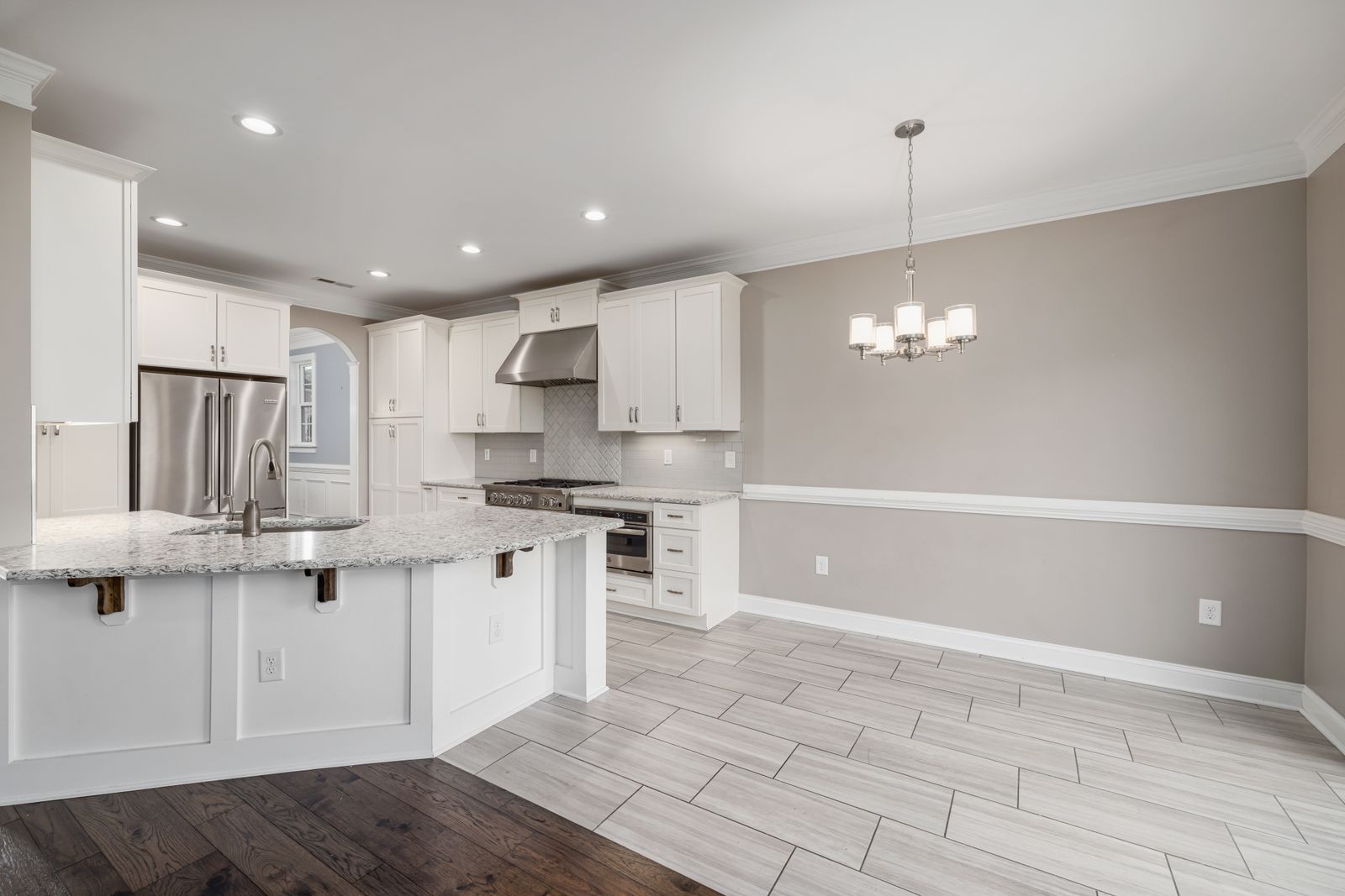 Bright kitchen with white cabinets, a typical real estate editing job