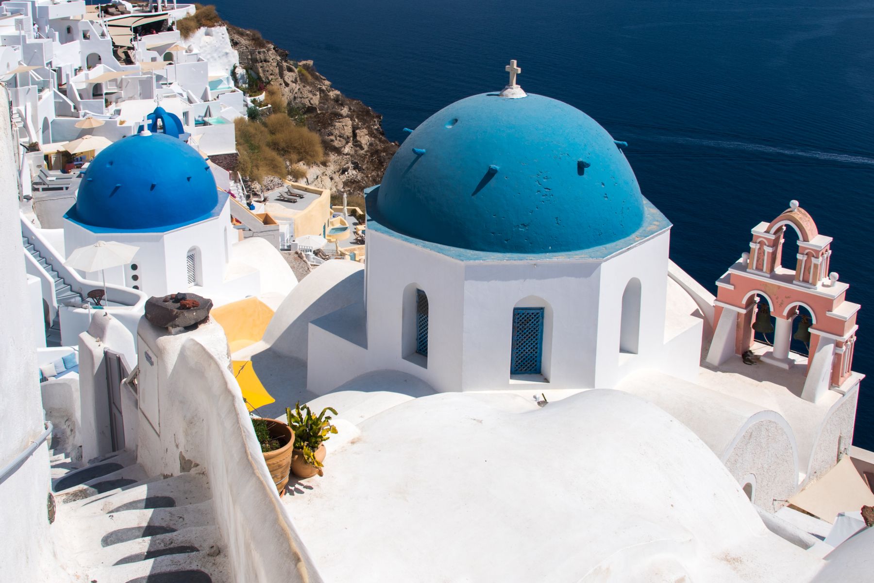 Blue domed churches and white stairs above the sea on Santorini
