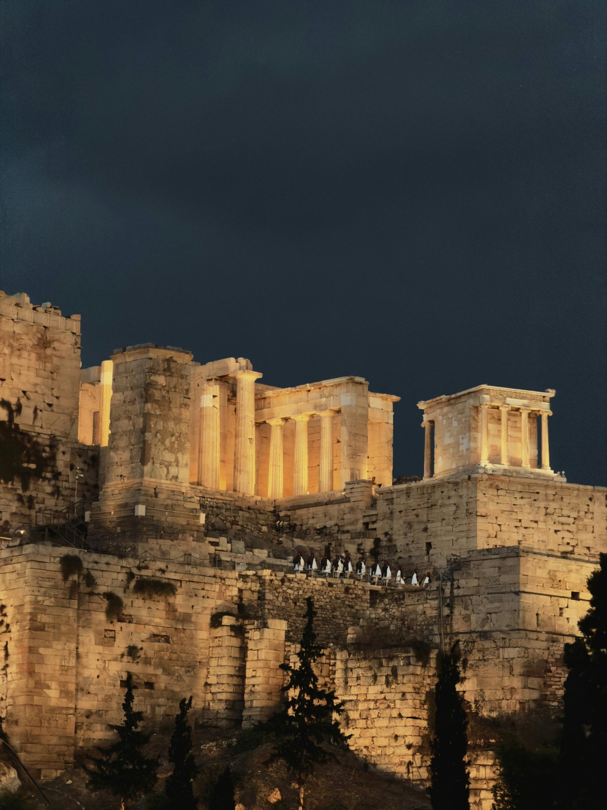 The floodlit Propylaea and the Temple of Athena Nike on the Acropolis at night