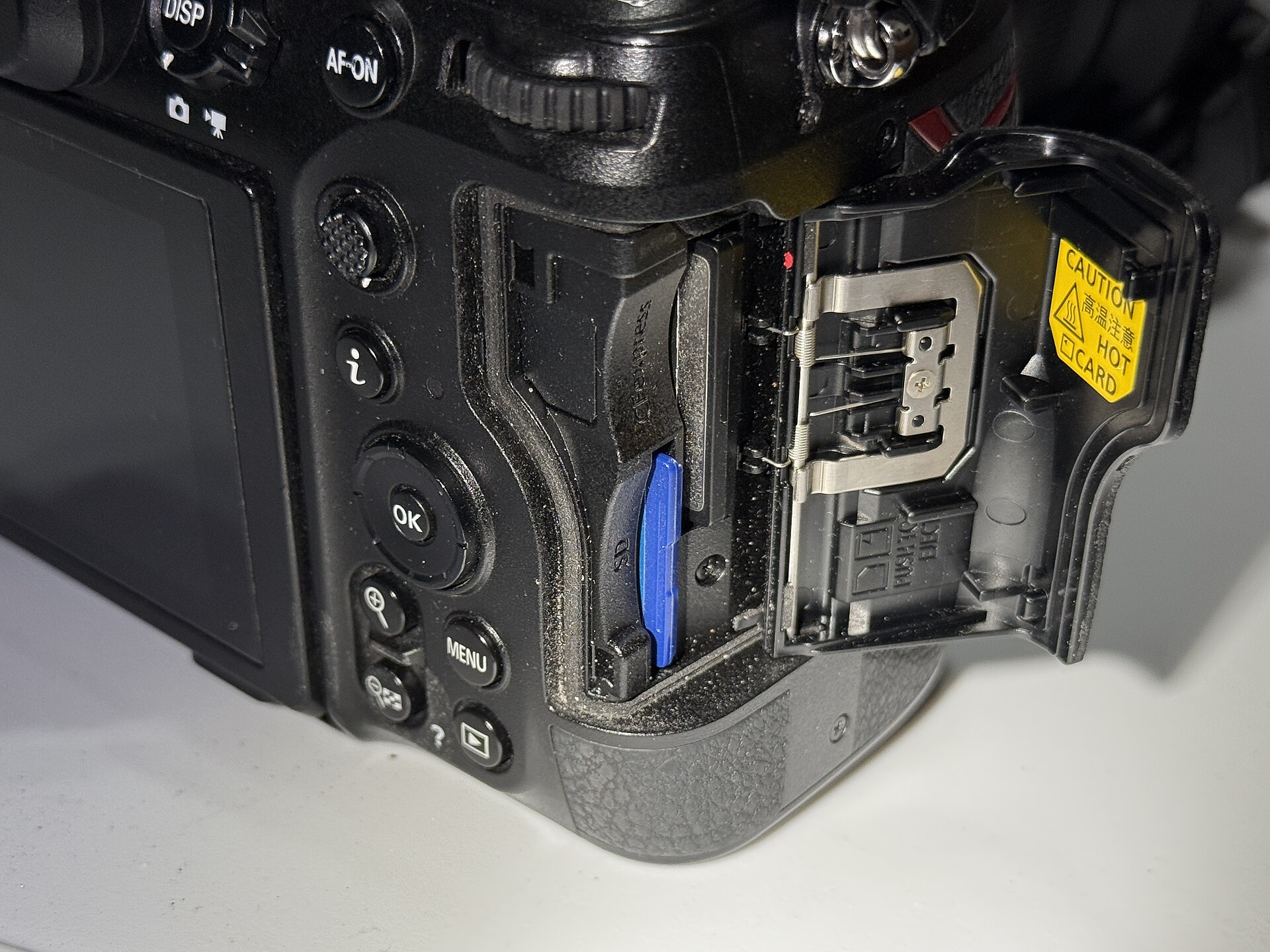 Nikon Z8 memory card slots close up, one CFexpress Type B card and one SD UHS-II card