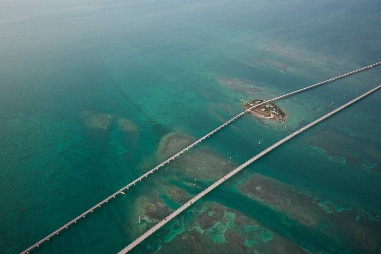 Aerial view of the Seven Mile Bridge and turquoise water in the Florida Keys, photographed by Edin Chavez