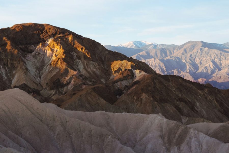 Warm light across eroded badlands at Zabriskie Point.