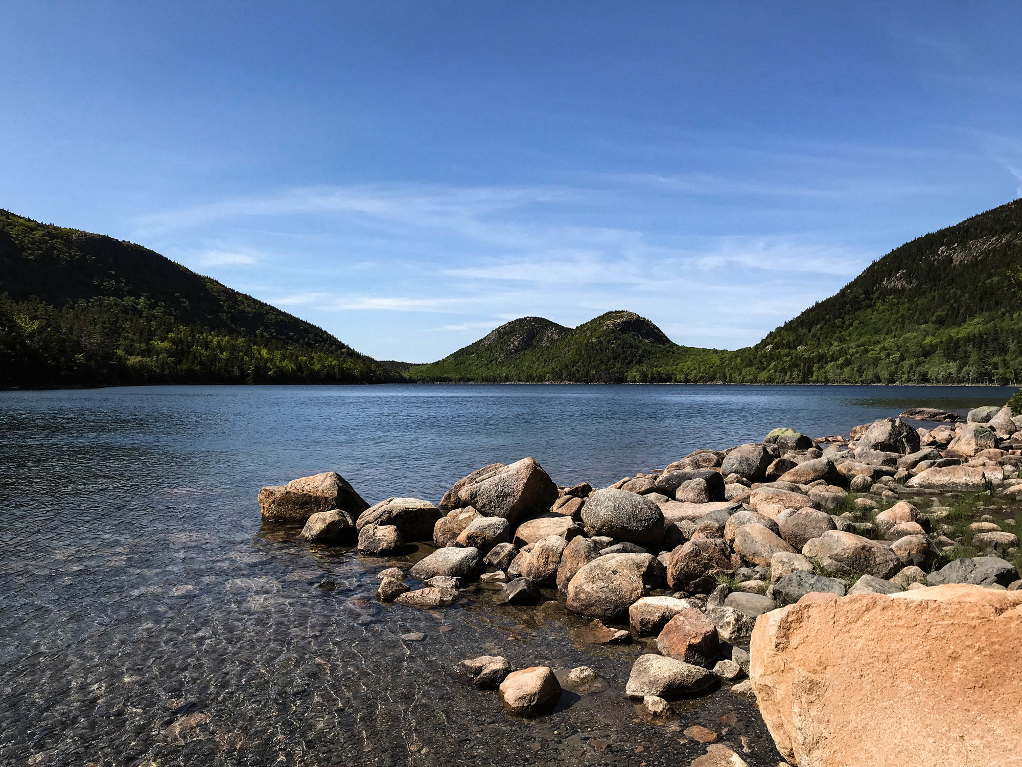 Jordan Pond and the Bubbles above a rocky shoreline in Acadia National Park