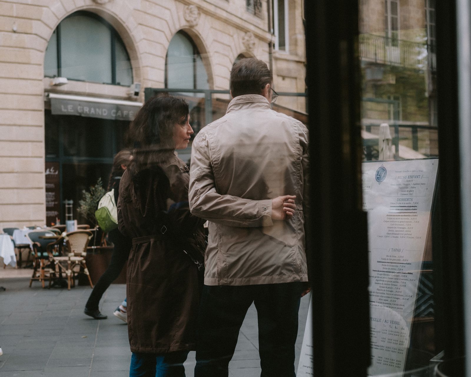 People walking along a busy city street