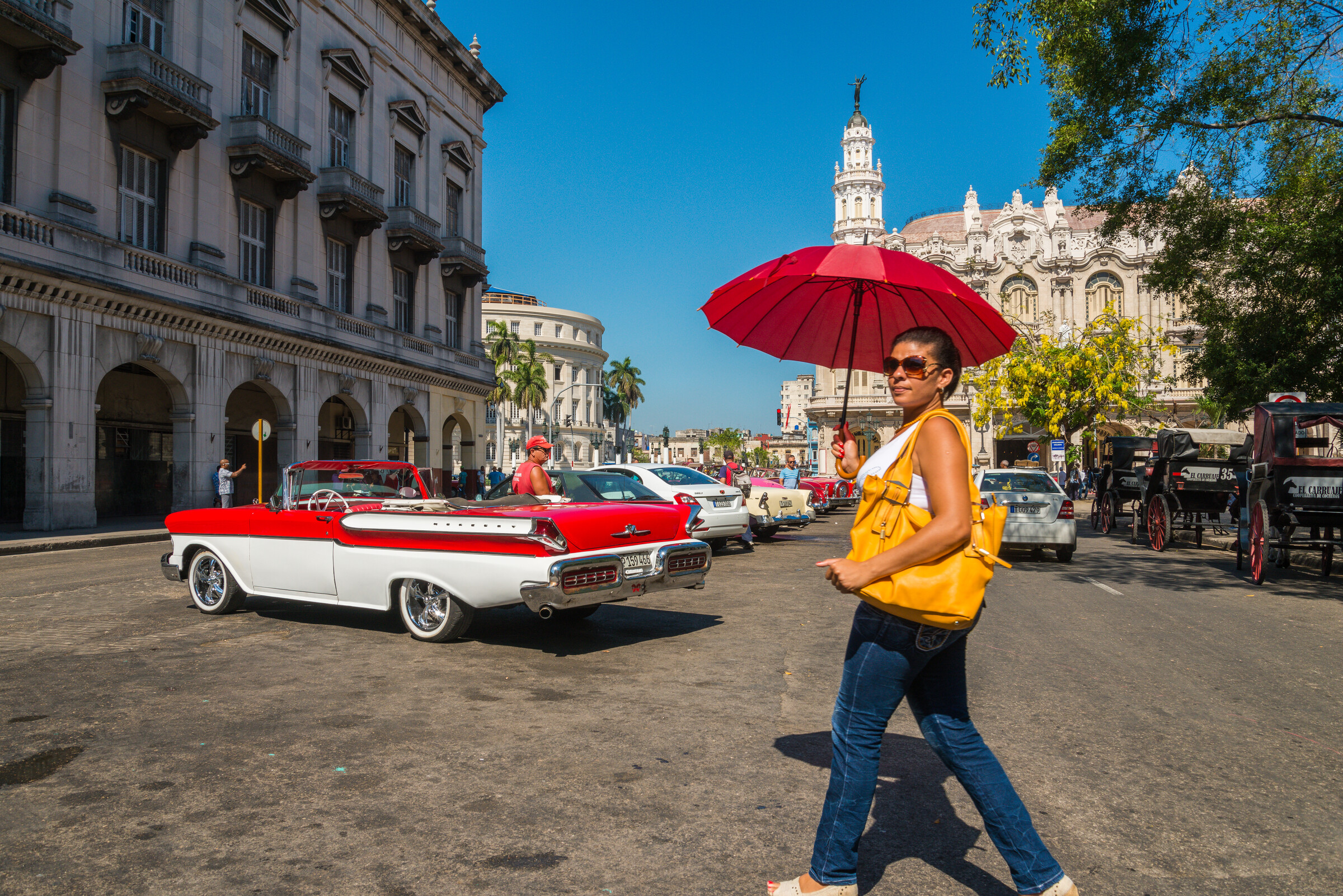 A classic convertible on a Havana street in front of the Capitolio, sharp from foreground to skyline