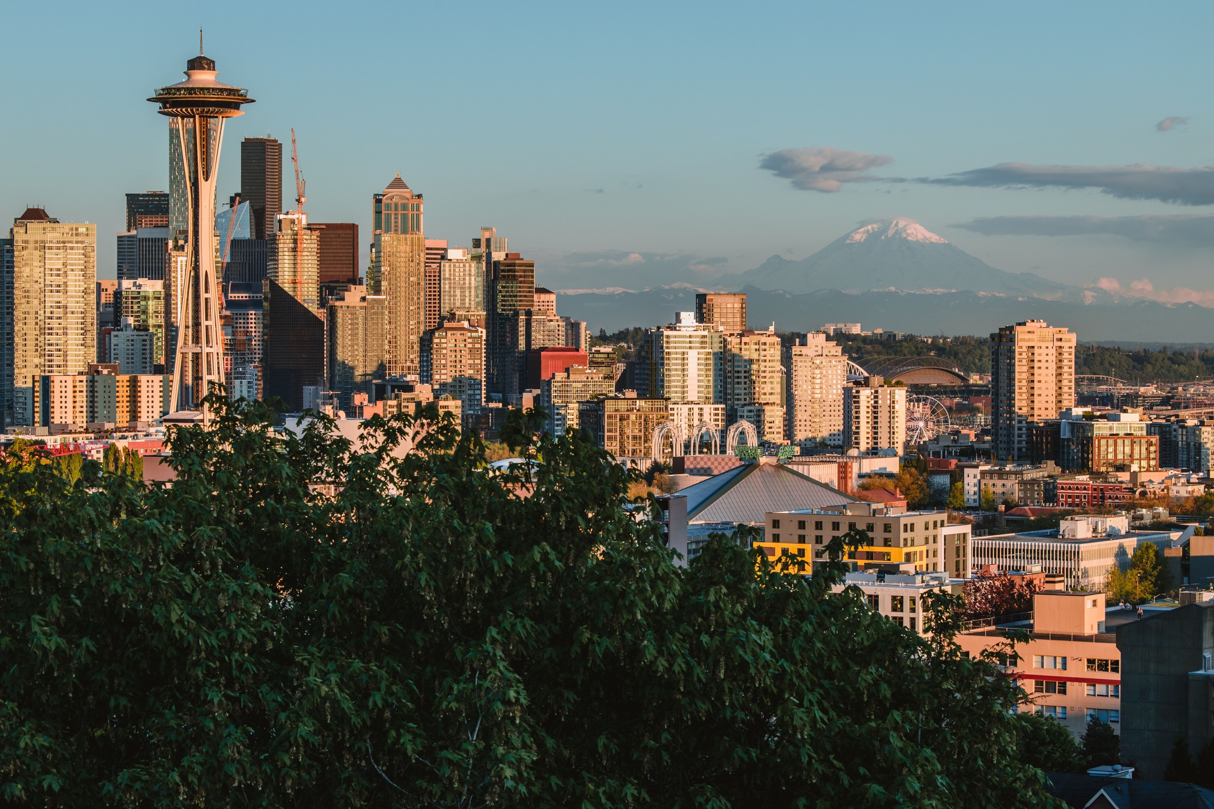Seattle skyline with Space Needle and Mount Rainier in warm light