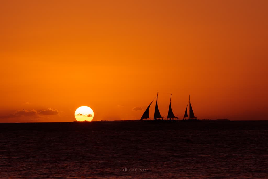 Mallory Square sunset and sailboat silhouette, historic photograph by Edin Chavez