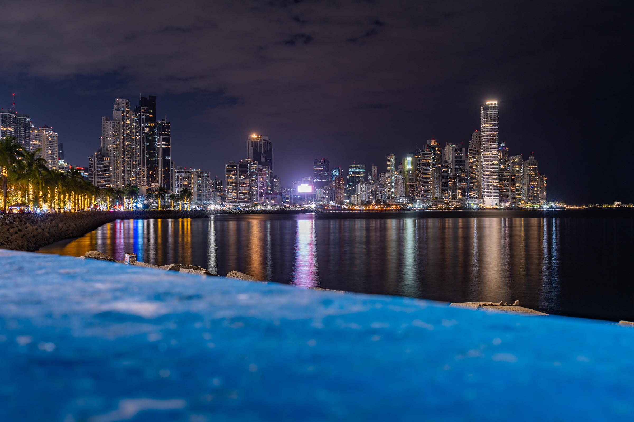 Panama City bayfront skyline reflected at night, photographed by Edin Chavez