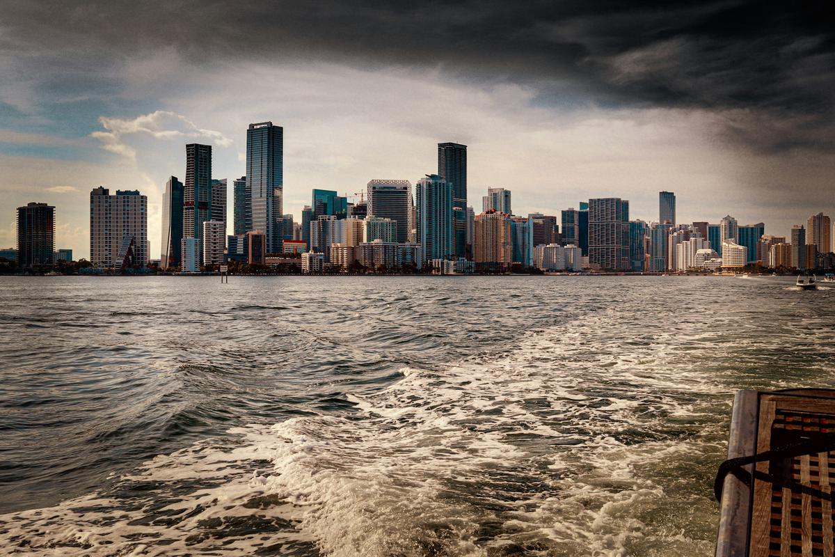 Panoramic view of Miami's skyline at sunset from MacArthur Causeway, with boats in the foreground