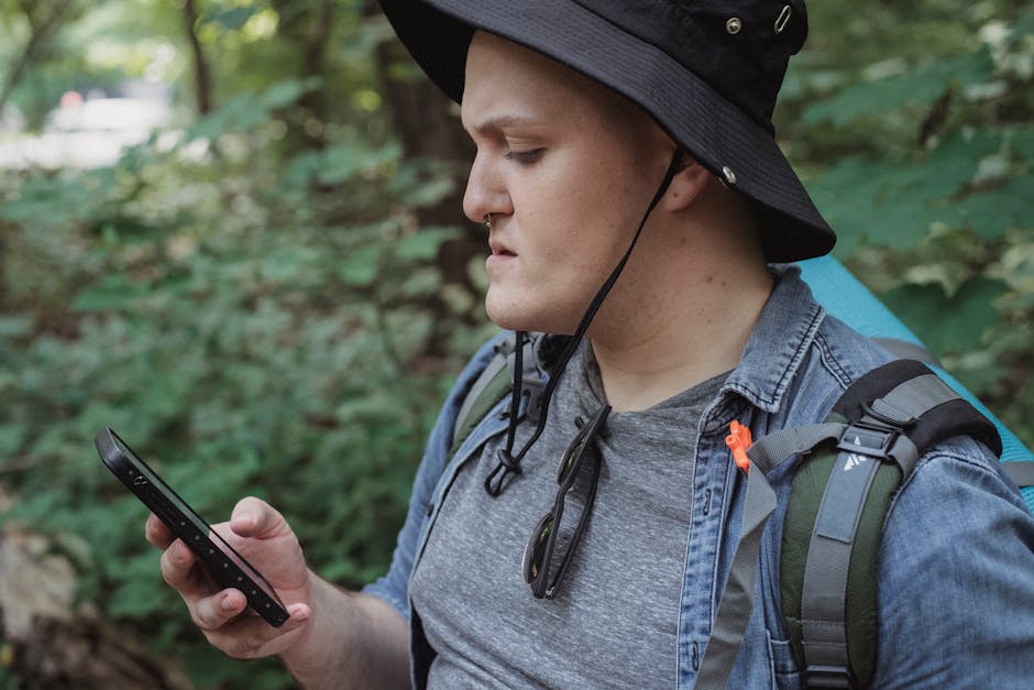A solo traveler using a smartphone navigation app to find their way in a new city. The traveler appears confident and at ease, demonstrating the importance of using technology to navigate and stay connected while traveling solo.